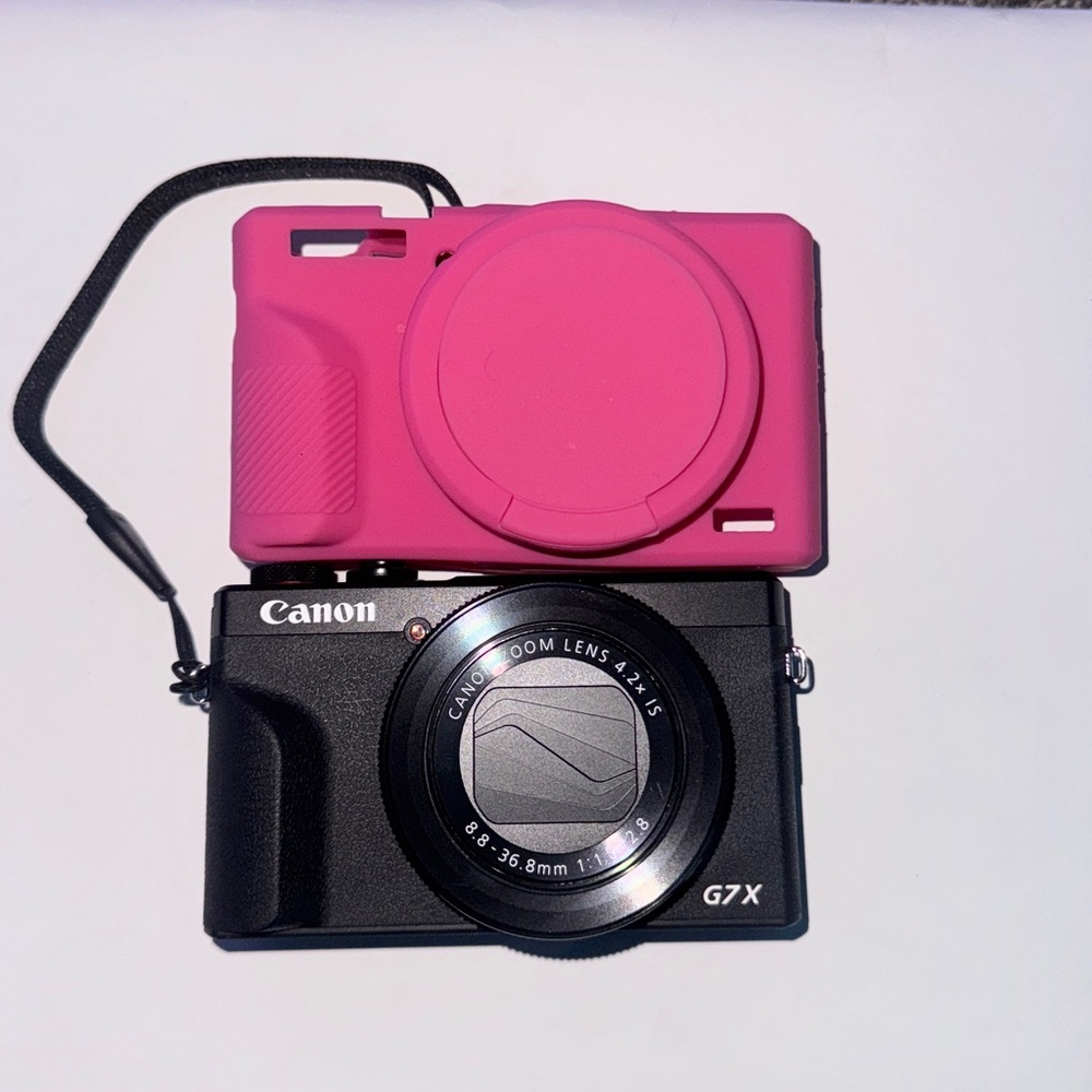 Canon G7X iii with pink cover and a black case
